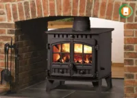 An outdated back boiler unit, often hidden behind a fireplace, known for being inefficient and costly to run.